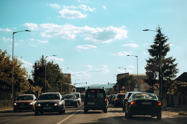 cars tailgating and driving on the road